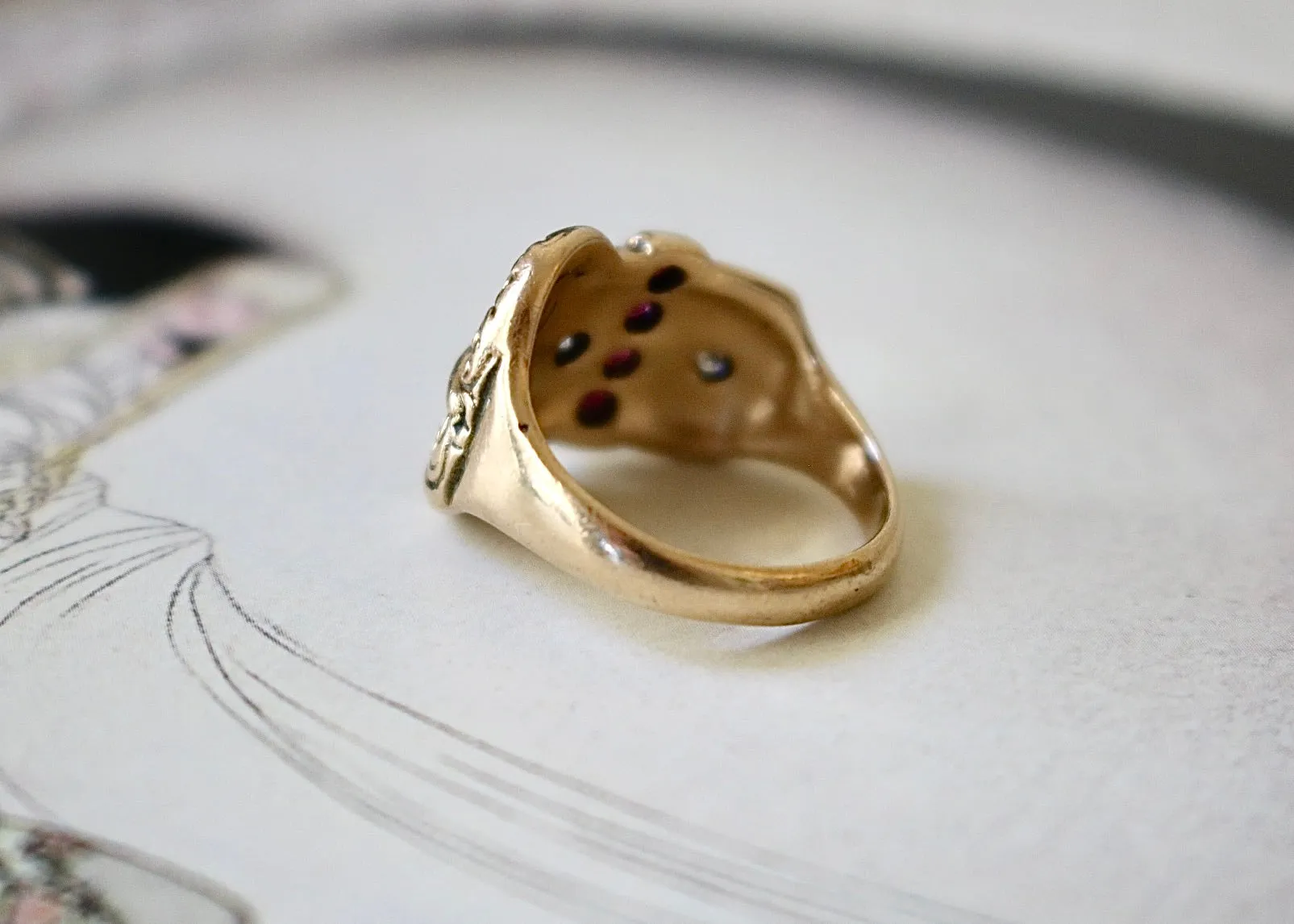 14k Gold Diamond Buckle Ring with Garnets