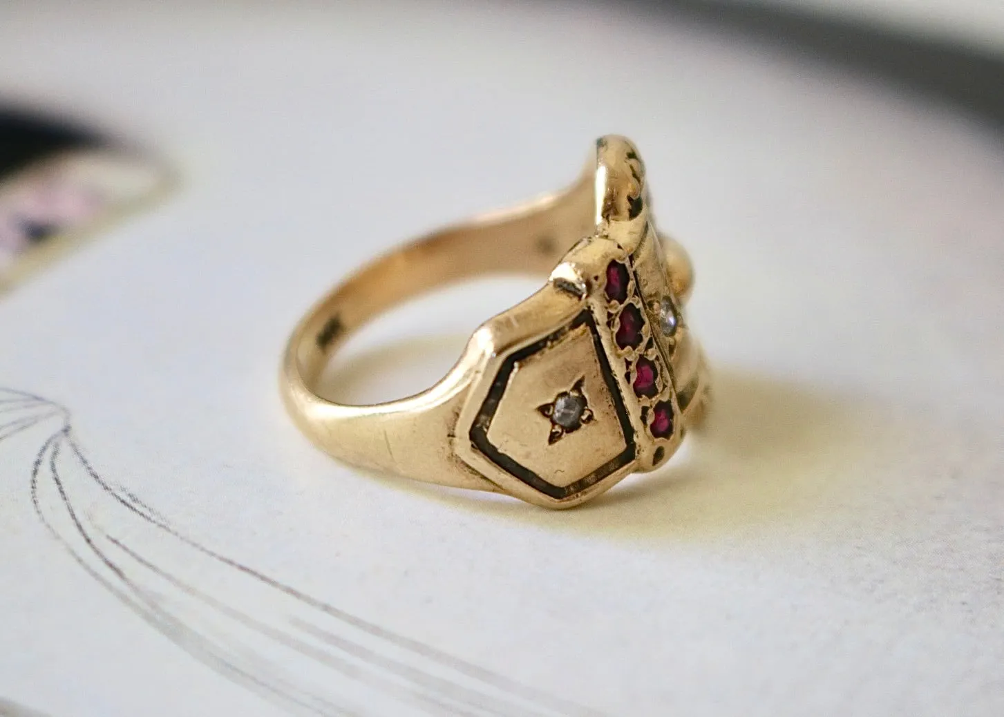 14k Gold Diamond Buckle Ring with Garnets