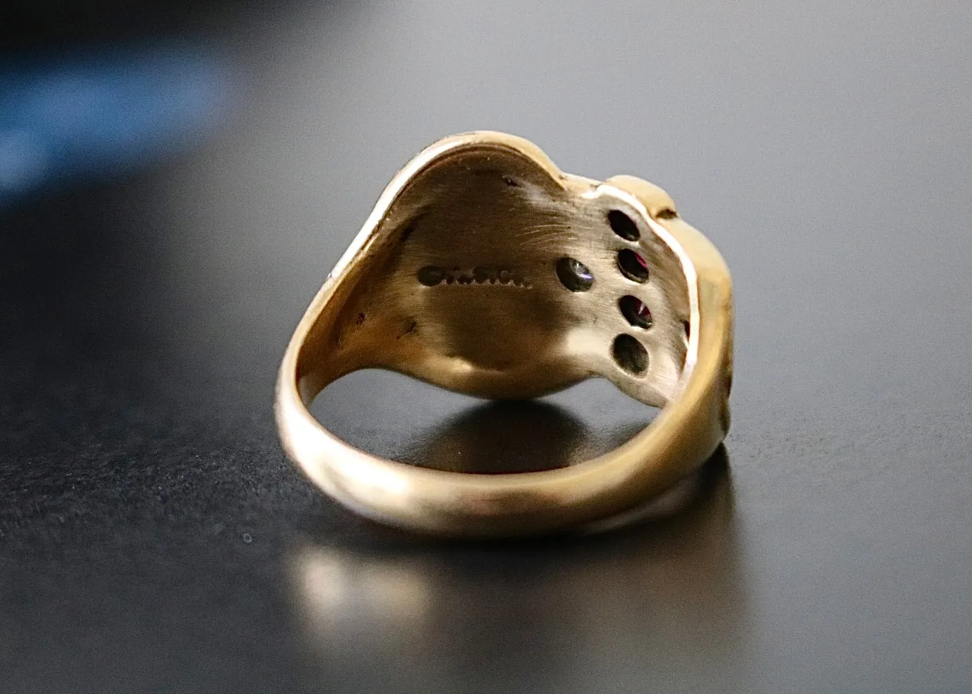 14k Gold Diamond Buckle Ring with Garnets