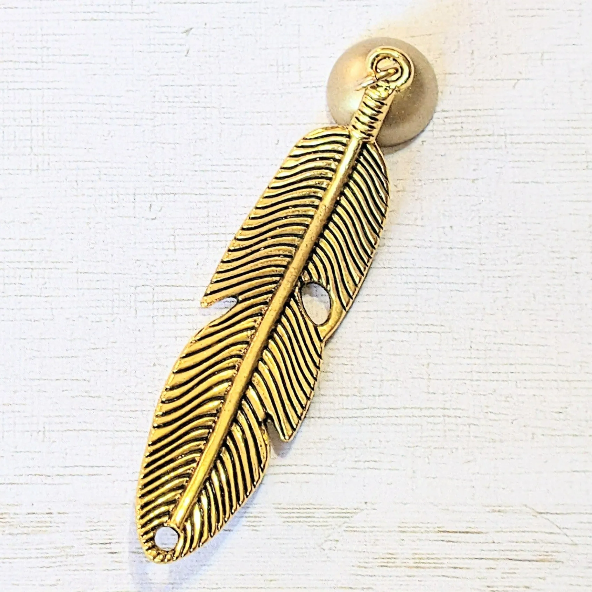 Gold Curved Feather Pendant